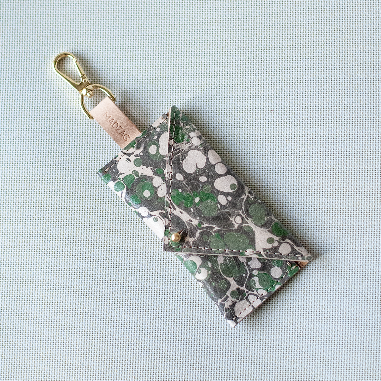 Márványos Zacskótartó