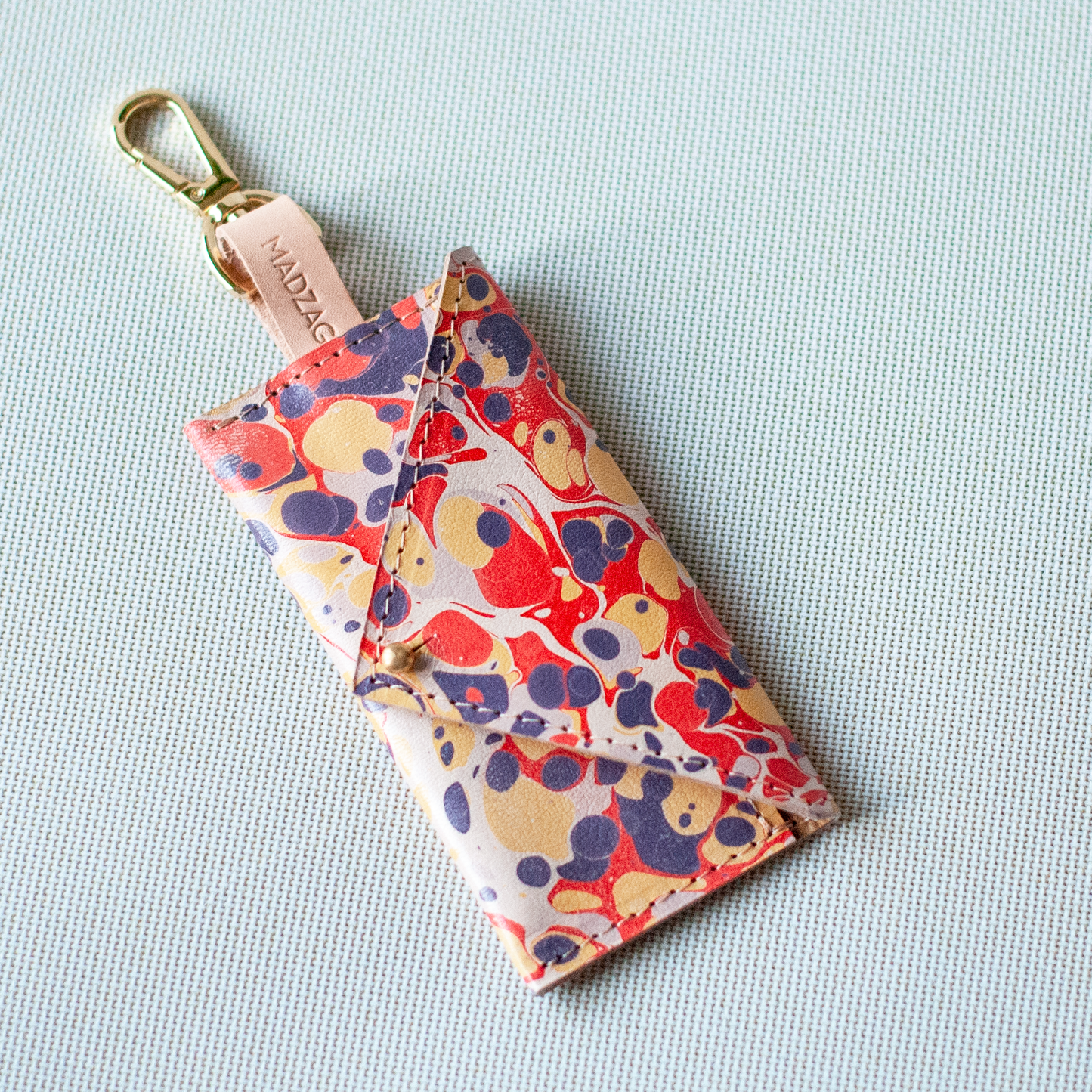 Márványos Zacskótartó